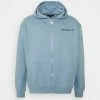 Mennace ESSENTIAL REGULAR ZIP UP HOODIE UNISEX - Sweatjacke - Sky Blue