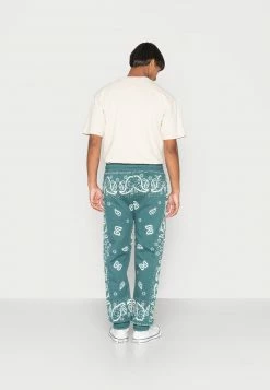 MENNACE JOGGER UNISEX - Jogginghose - Green -Mennace Speichern 7f81f6c232334adea9a5bff55a71b727