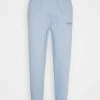 Mennace CLUB JOGGER UNISEX - Jogginghose - Light Blue
